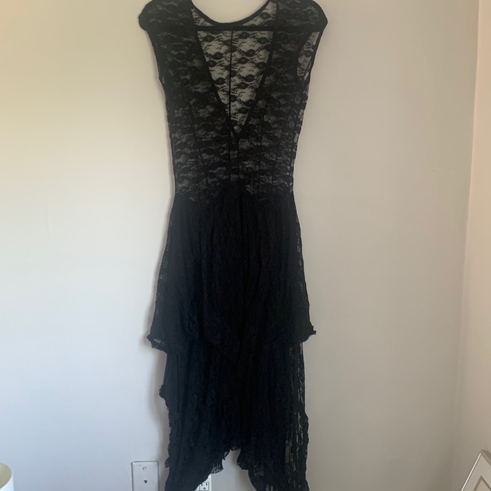 Lace over dress. Looks best with tank dress or unitard. Unique piece.